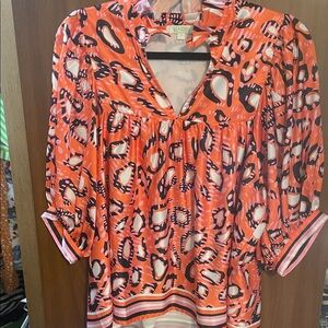 Jade Melody Tam Vibrant Orange and Black Patterned Blouse